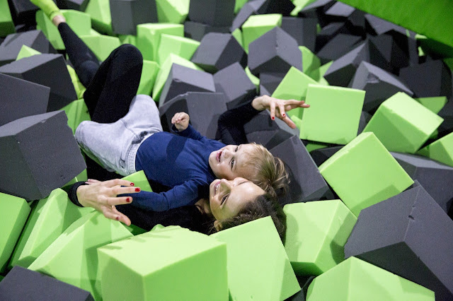 Parent and child enjoying softplay together