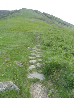 uphill path through grass in Scotland