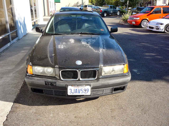 1994 BMW 325iS with peeling paint before repairs at Almost Everything Auto Body