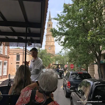 horse-drawn carriage tour of Charleston, South Carolina, with view of leaning St. Philip's Church