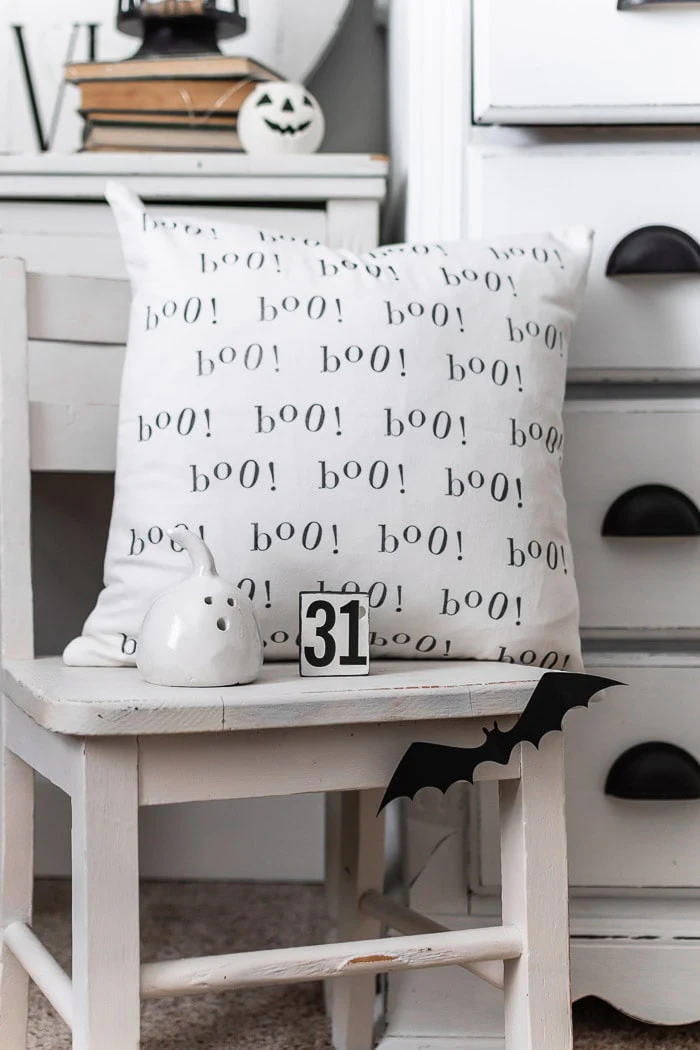black and white pillow cover, bats, ghosts, white vintage chair and dresser