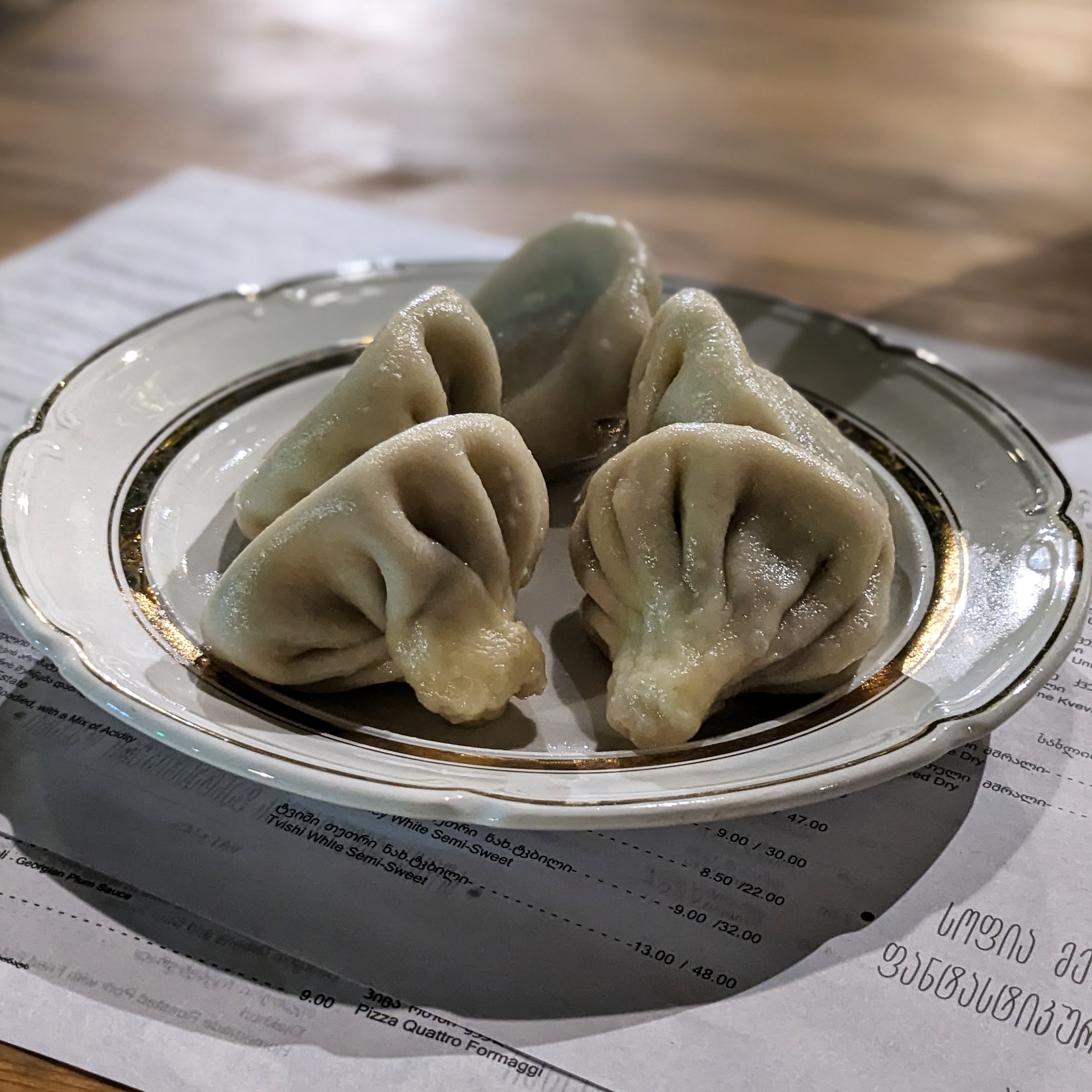 A plate of the best khinkali in tbilisi at Sofia Melnikova's Fantastic Douqan