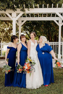 bride with bridesmaids in royal blue dresses