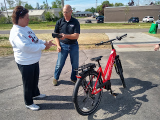 man, woman, electric bicycle