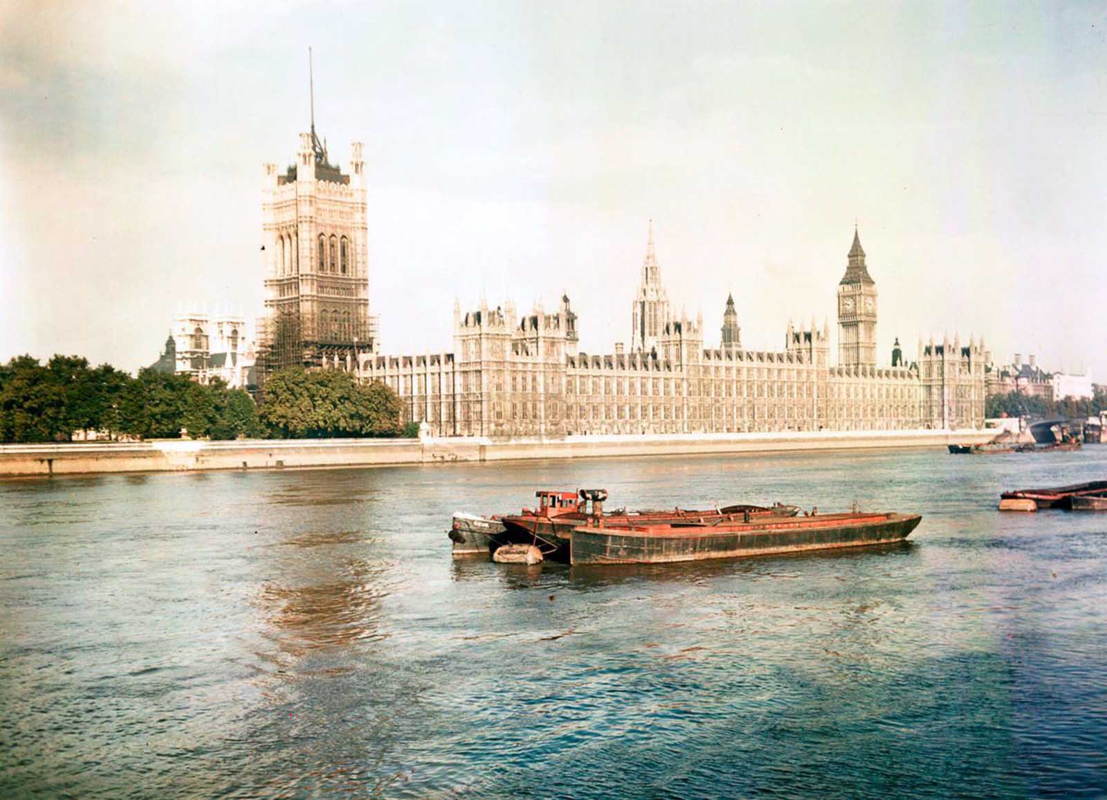 Barges on the River Thames in front of the Houses of Parliament. Dec. 10, 1945.