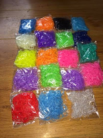 Bags of coloured loom bands 