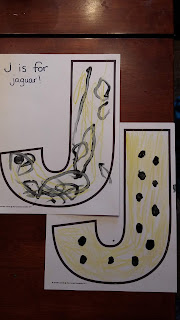 Color the letter J yellow and add black dots with qtips or with fingers.