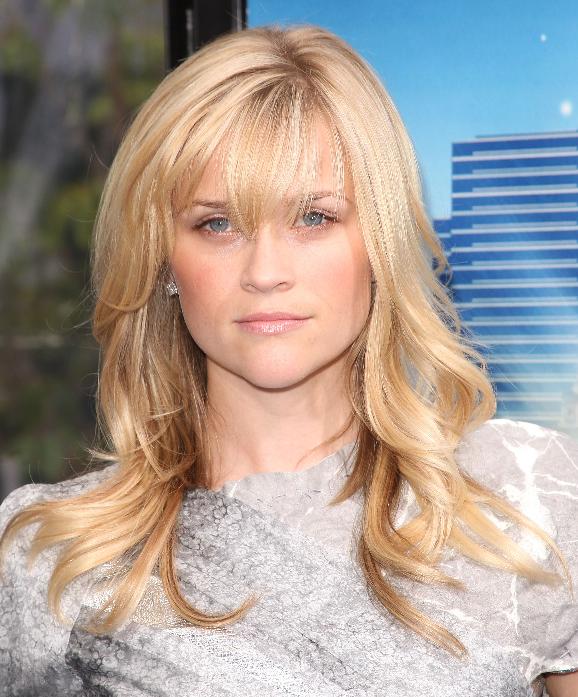 REESE WITHERSPOON's bangs make her look younger and more charming