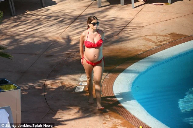 Tanya Bardsley flaunts baby bump in red bikini