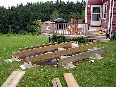 The joists have been temporarily set in the blocks to make sure they stay aligned.