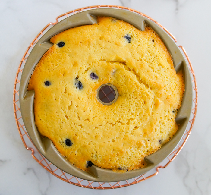    You know how we love to celebrate a    Frosted Lemon Blueberry Bundt Cake 