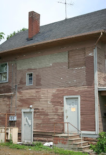 [House chimney demolished for urban redevelopment]