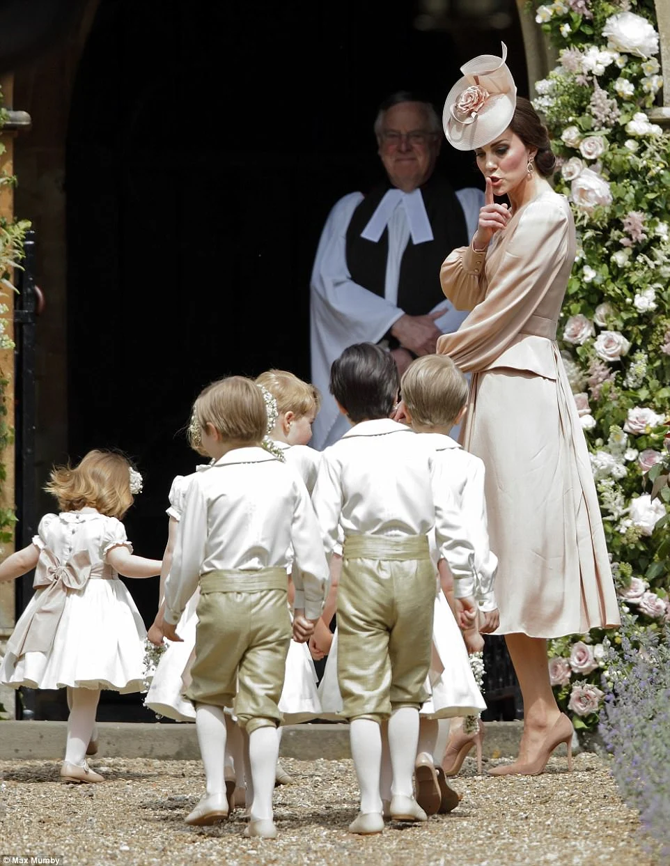 Kate Middleton stays low-key in peach at Pippa's wedding