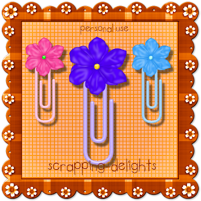 http://scrapping-delights.blogspot.com/2009/08/flower-paperclips-freebie.html