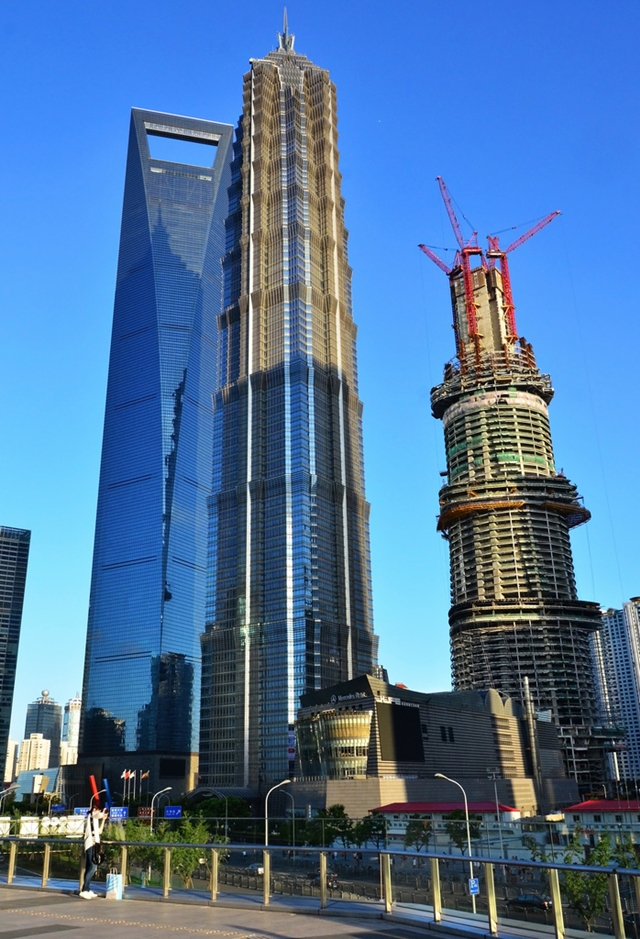 Shanghai Tower under construction with Jin Mao tower and World Financial Center