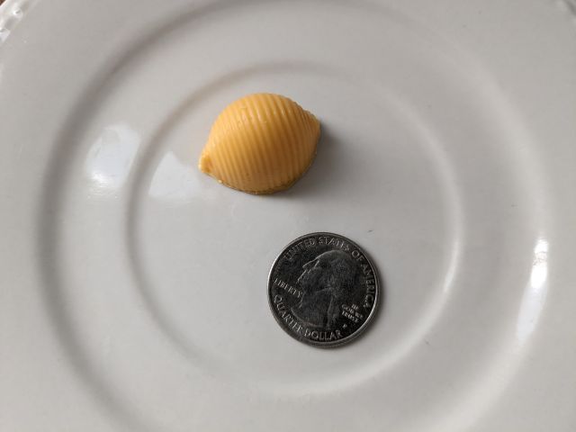 Velveeta x Compartés TruffVels top-down with quarter for size comparison.