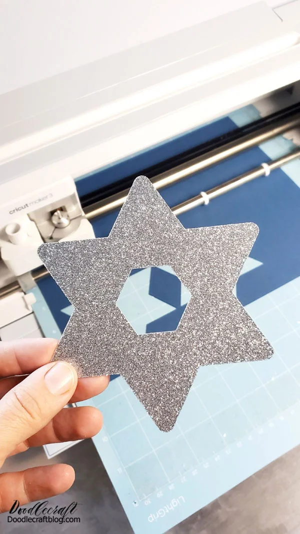 How to Make a Star of David Cake Topper: Silver Glitter Cardstock Blue Cardstock Cricut Machine Skewers Hot Glue/Gun Cricut Design Space Project