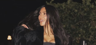 Kim Kardashian Flaunts Sculpted Figure in Bandeau Top and Fuzzy Black Pants Amid Taylor Swift Drama