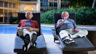 The Last Laugh 2019 Netflix Chevy Chase Richard Dreyfuss lounging by a pool