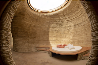 The curved inside of a house printed from earth