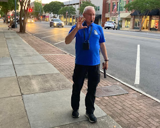 Photo of John Tucker, guide for Downtown Salisbury Ghost Walk. He is standing on the sidewalk by Main Street. © Photo by AW