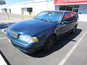 Faded, peeling paint on Volvo V70 Wagon.