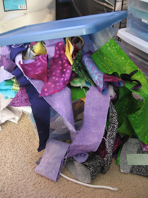 Overflowing box of fabric scraps