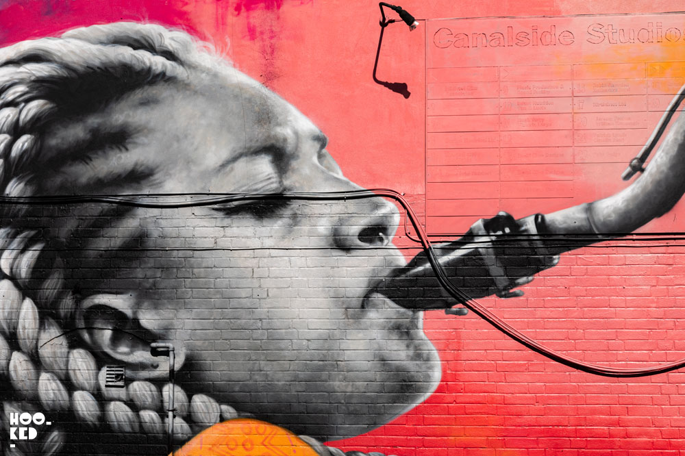 French street artist Zabou at work on her Mural in Haggerston, London