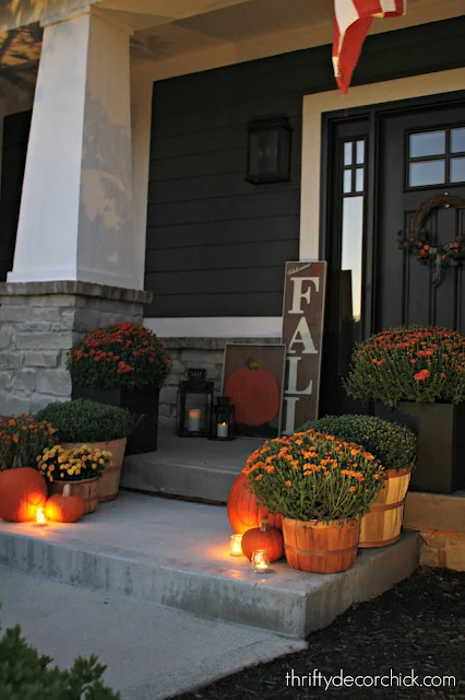 Fall porch with mums and pumpkins