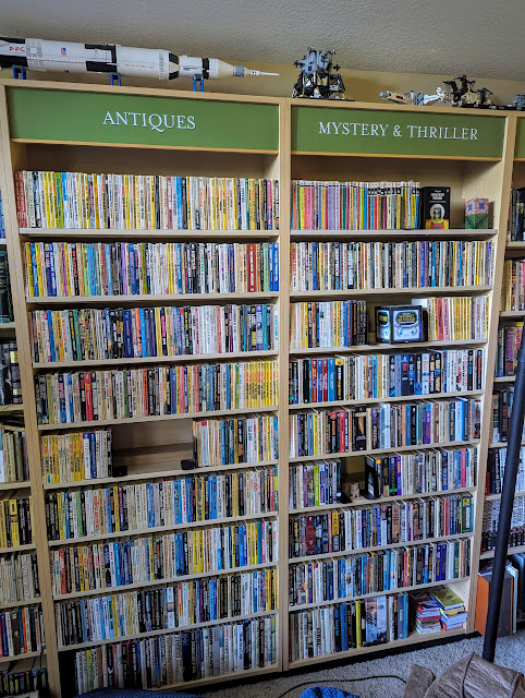 2 bookshelves full of mostly paperback books.