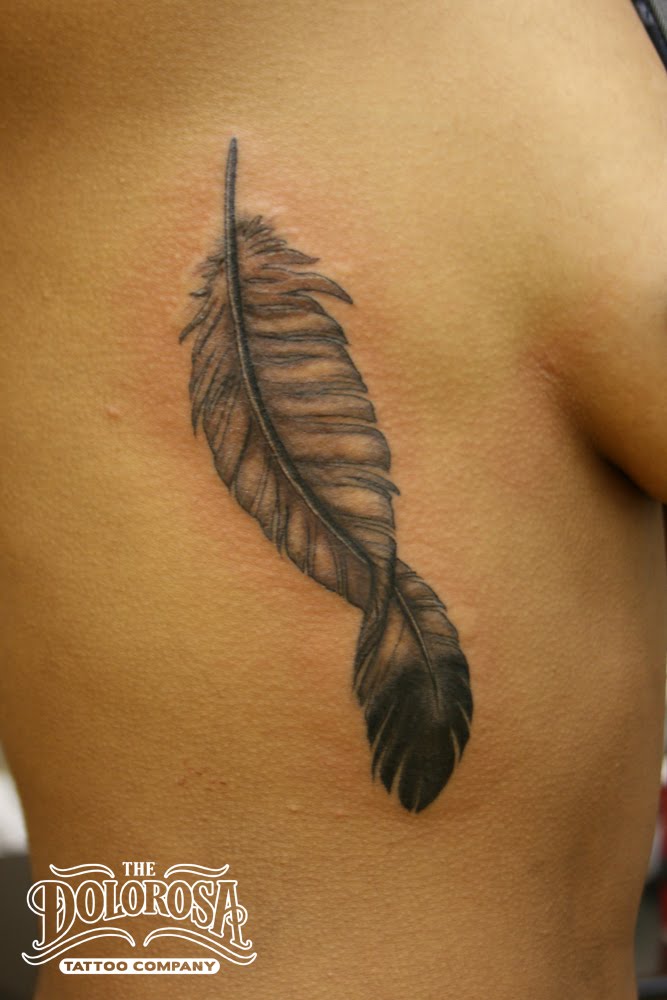 Little black and grey feather tattoo This was her first one and she sat 