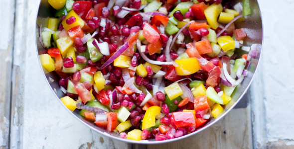 Colorful salad with pomegranate and honey dressing