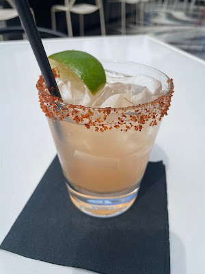 Refreshing spicy margarita cocktail served in a unique glass at Upstairs at The Gwen, Chicago