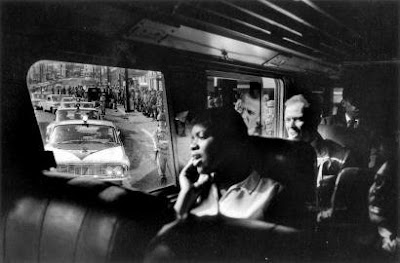 During the 1961 Freedom Rides, Bruce Davidson captured this image of riders singing.