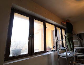 Up on the small scaffold fitting the new curtain rail