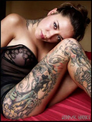 Hot lady with Full body tattoo on legs and neck