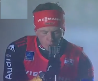 German biathlete Florian Graf points rifle at own face