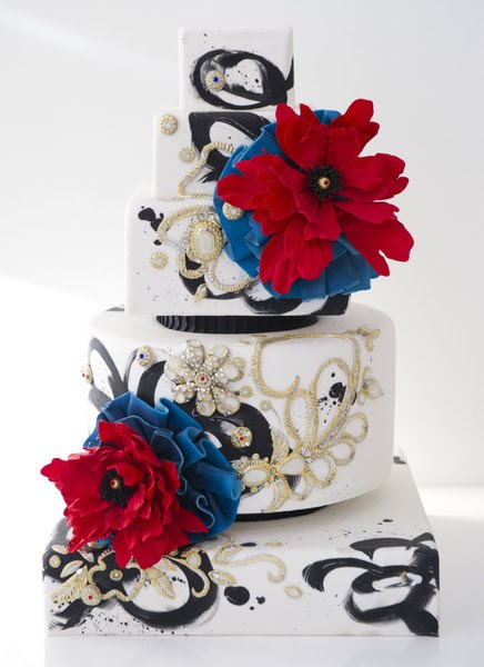 From Confetti Cakes comes this really original folk art wedding cake in blue