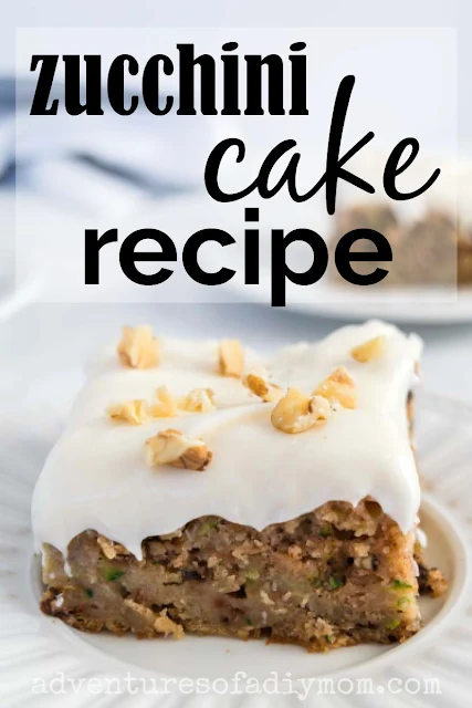 slice of zucchini cake with cream cheese frosting and walnuts