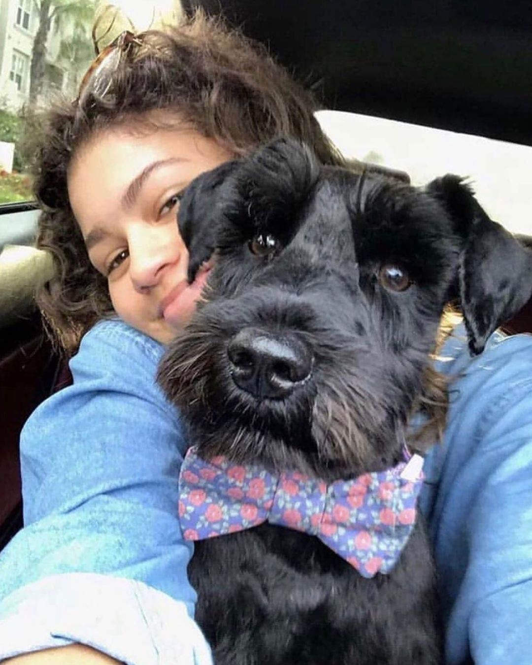 Zendaya and her dog posing for the camera