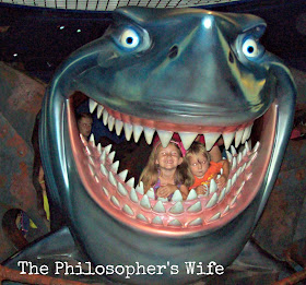 Two kids in Bruce's mouth, from Finding Nemo, located in the Seas at EPCOT.