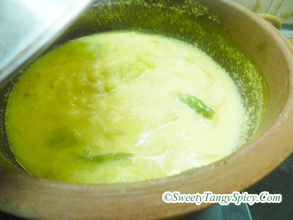 Mixing Coconut Spice Paste with Cooked Tomatoes