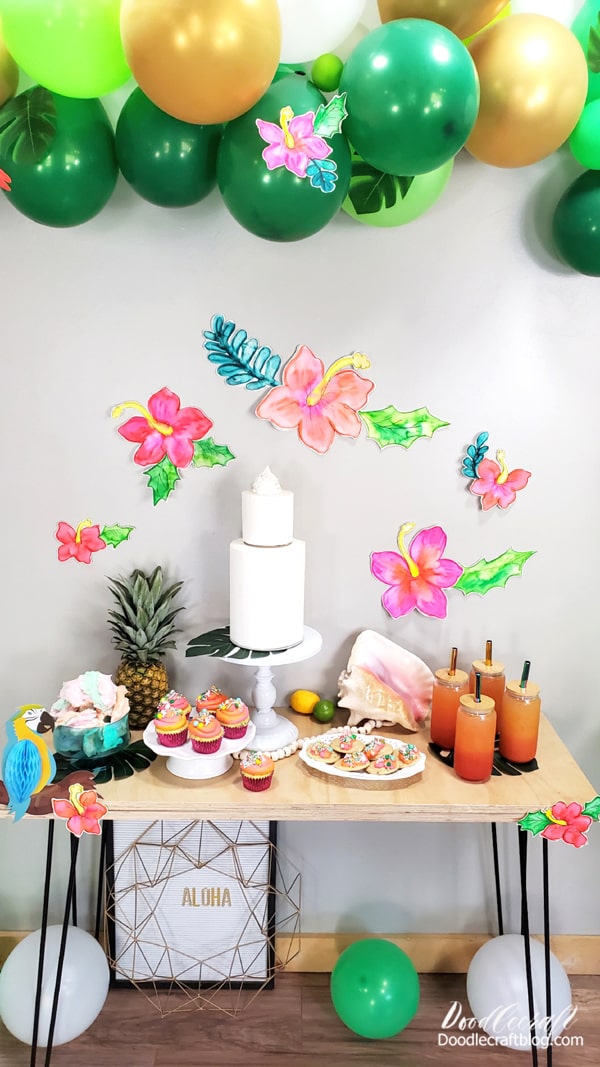 Then use painters tape to hang the watercolor hibiscus flowers up on the wall, on balloons or on the table for your party!