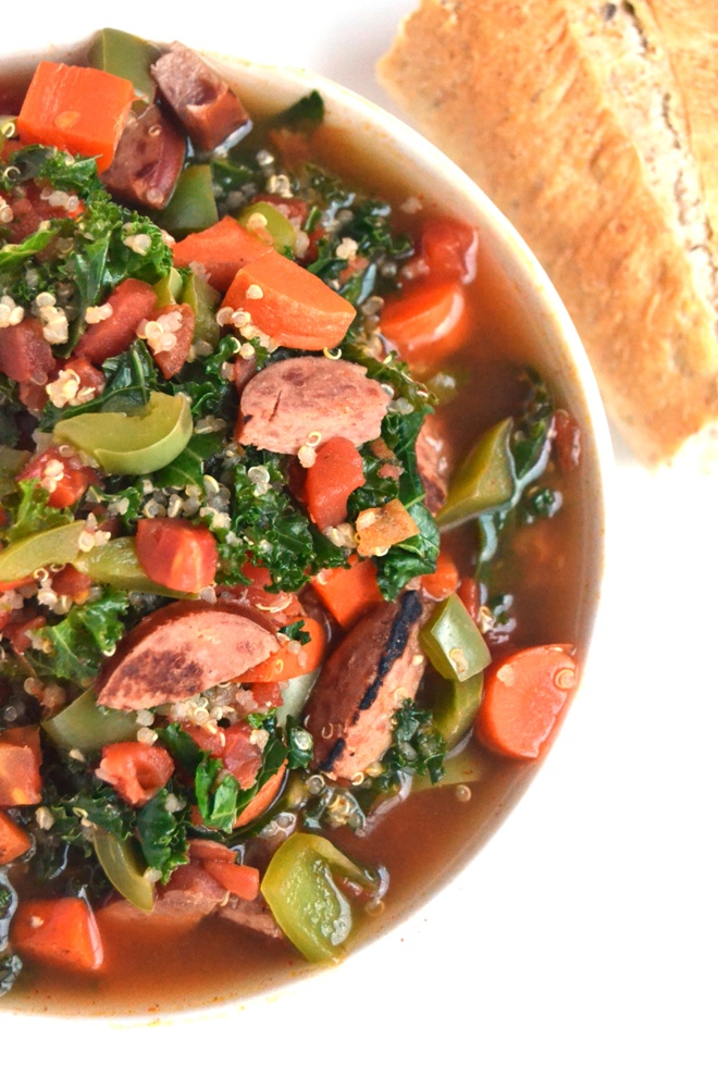 Smoky Sausage, Kale and Quinoa Soup is the perfect hearty, nutritious soup that is full of flavor and spice that your family will love! www.nutritionistreviews.com