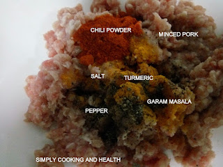 Marinate pork with chili,,pepper, turmeric powders,garam masala and salt