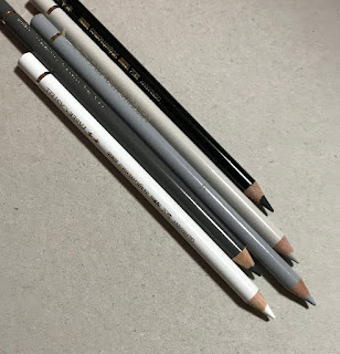 Neutral colour pencils, Faber Castell, polychromes pencils on brown background