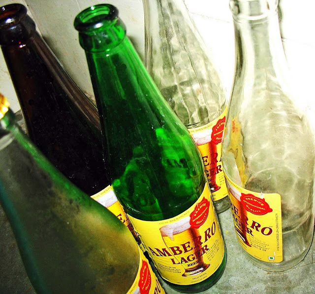 empty beer bottles different colours