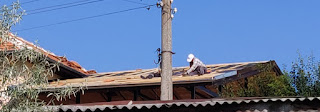 Men battening the roof