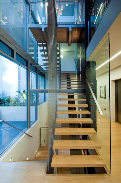 Photo of modern staircase leading to the first floor and the basement in an amazing home in Sydney, Australia