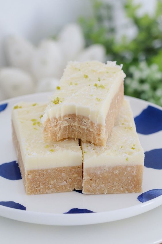 The easiest and most delicious Lime & Coconut Slice you'll ever make! Made from crushed biscuits, butter, sweetened condensed milk, coconut & lime juice with a creamy and tangy lime frosting. Conventional & Thermomix printable recipe cards included.